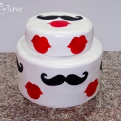 Mustache and lips baby shower cake