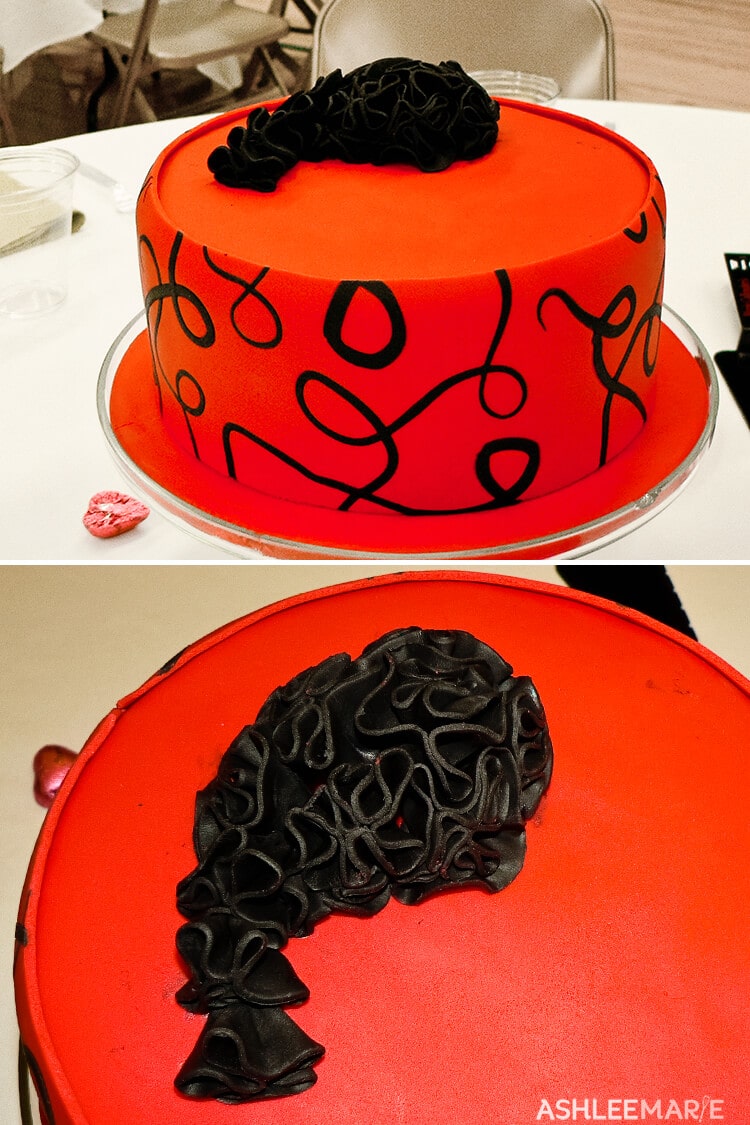 black ruffled red fondant cake
