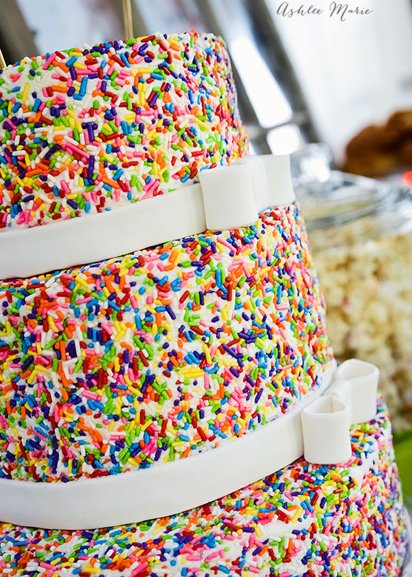 a sprinkles cake can be dressed up easily with a fondant ribbon and bow at the bottom of each tier