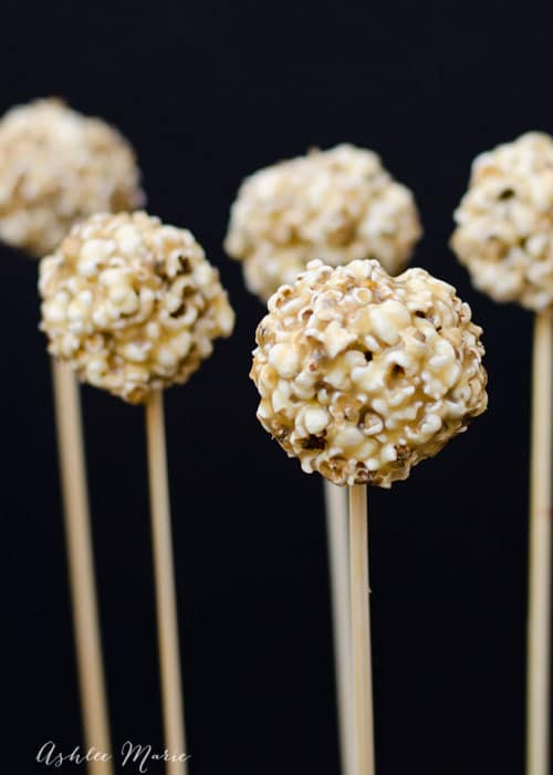 it doesn't get more fun than mini food, these mini caramel popcorn balls on stick are such a fun treat!