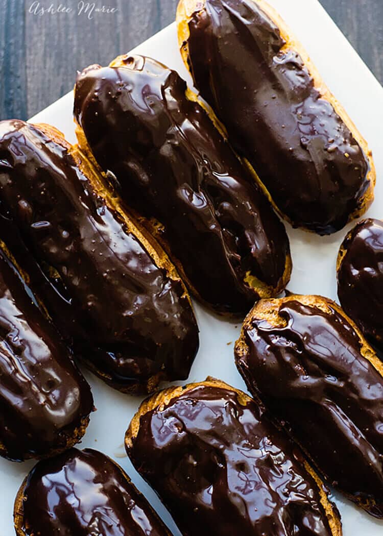 these homemade chocolate eclairs are a sweet treat - full recipes and video tutorial for the pate a choux dough, chocolate pastry cream filling and ganache glaze