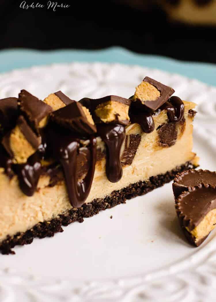 topped with hot fudge and filled with chunks of peanut butter cup this peanut butter cheesecake with a chocolate crust is simply divine