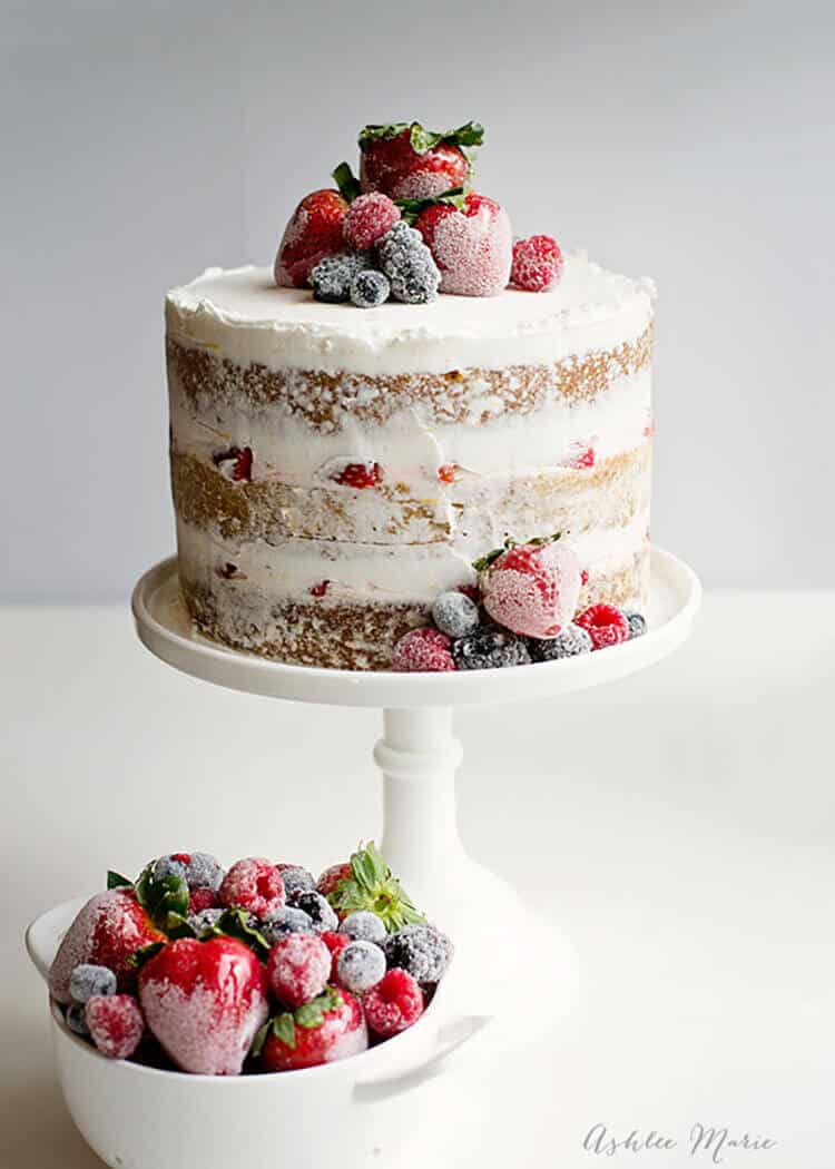 A quick and easy layered summer cake with candied strawberries and sugared berries, sweet and refreshing!