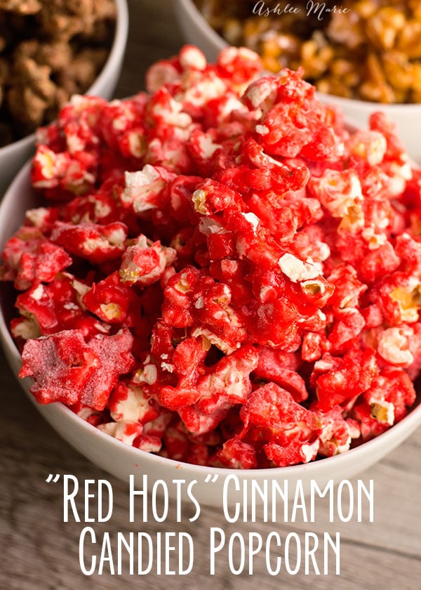 this candy coated popcorn is made with cinnamon red hots for a spicy bite