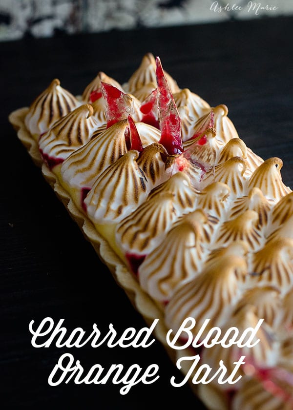 this tart has an amazing sweet and easy crust, a tart citrus filling and a delicious marshmallow icing, add some "bloody" berry coulis and sugar glass shards for a Halloween treat