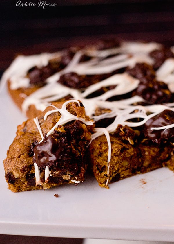 this halloween pumpkin blondie with chocolate chips and toasted walnuts is delicious on it's own, add some gingersnap crumble dirt, marshmallow spider webs and chocolate walnut bugs and you have a spooky treat - full video tutorial