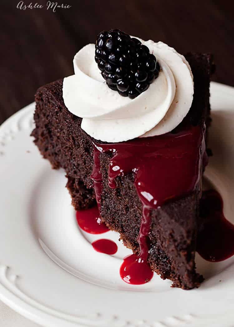 berry coulis is the perfect topping on this rich flourless chocolate cake