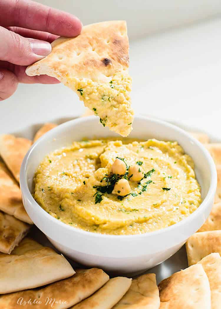 it is so easy to make this delicious hummus dip, perfect for a great snack and perfect for potlucks and parties