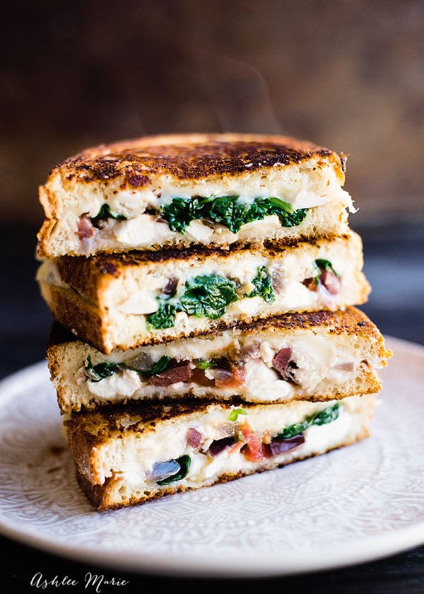 filed with three kinds of cheese, spinach, onions, tomatoes, olives and more this chicken Mediterranean grilled cheese is always a hit