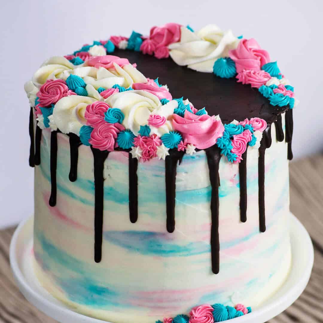 buttercream watercolor rosette cake with chocolate drips