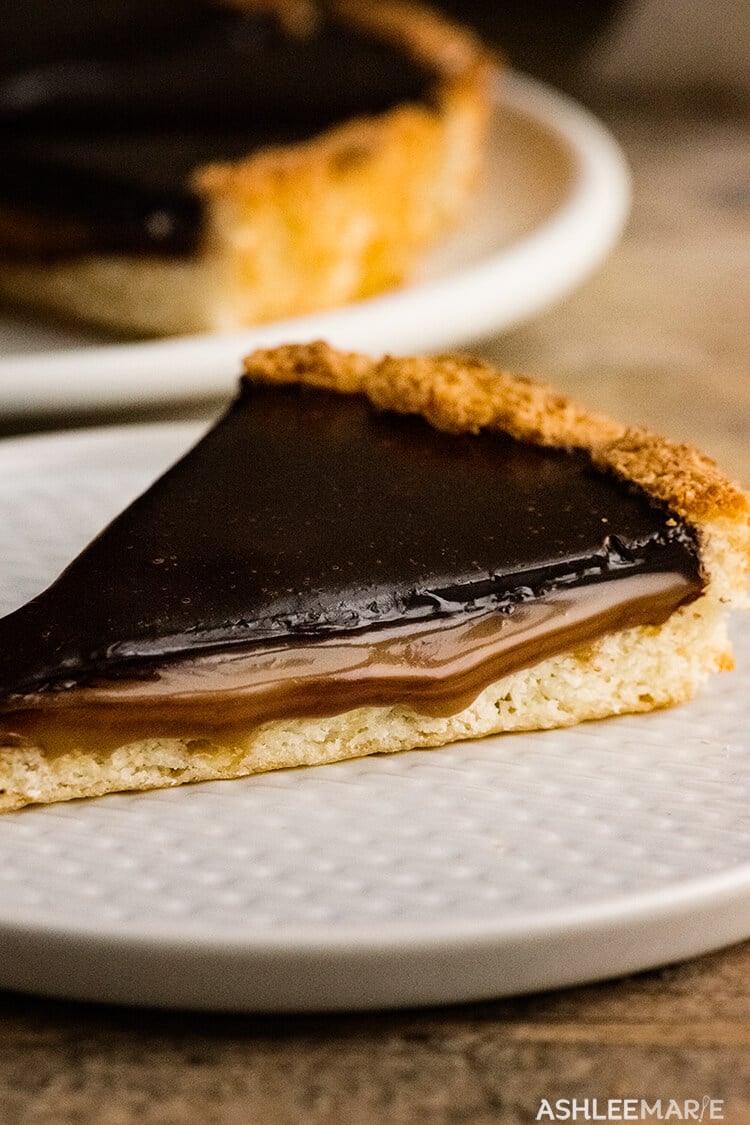 chocolate caramel tart in a macaroon cookie crust